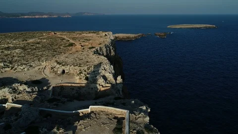 Aerial view of lighthouse on the edge of a cliff Stock Footage 116620273