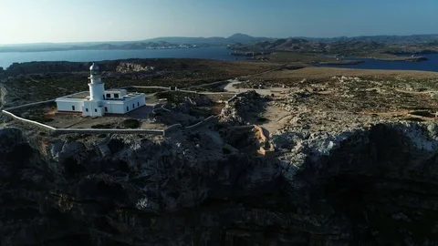 Aerial view of lighthouse on the edge of a cliff Stock Footage 119881384
