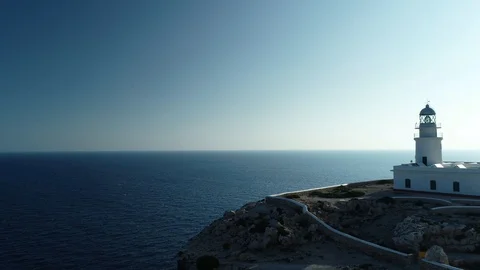 Aerial view of lighthouse on the edge of a cliff Stock Footage 120297815