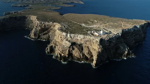 Aerial view of lighthouse on the edge of a cliff Stock Footage 120297838