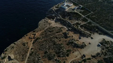 Aerial view of lighthouse on the edge of a cliff Stock Footage 120297846