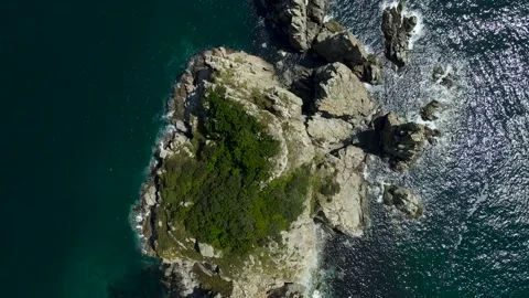 Aerial view, Lighthouse Gamow, Pacific Ocean, rocks, green grass on the mountain Stock Footage 162641243