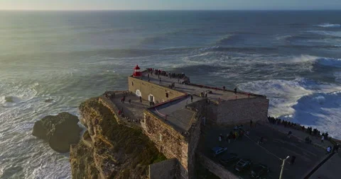 Aerial view of the lighthouse located on a huge cliff and offering a view of the Stock Footage 308969994