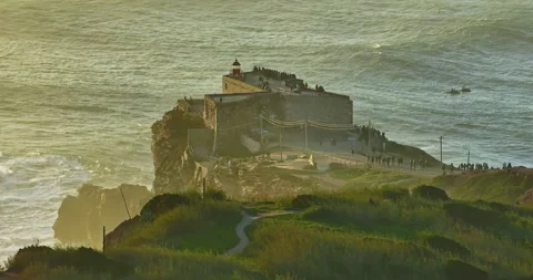 Aerial view of the lighthouse located on a huge cliff and offering a view of the 库存影片 308977168