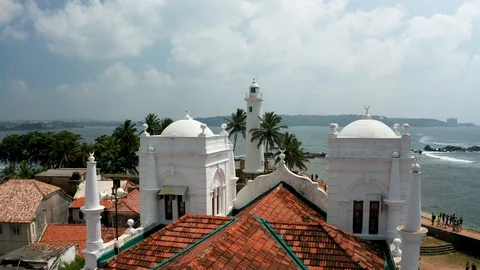 Aerial view of the lighthouse, mosque and fort in the southern part of the Stock Footage 103706245