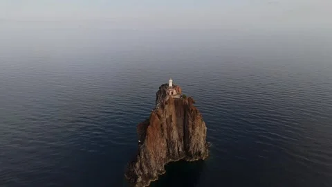 Aerial view of lighthouse on rocky islet near Lipari, Italy. Stock Footage 345667327