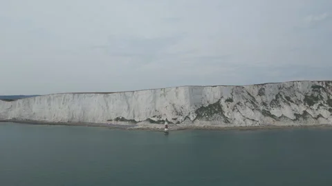 Aerial view of a lighthouse on the seaside by white cliffs. Stock Footage 244343130