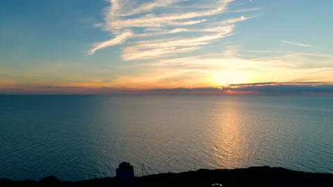 Aerial view of Lighthouse on a sunset background in the sea in summer. Stock-Footage 87420699