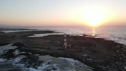 Aerial view of a lighthouse by sunset 库存影片 148046683