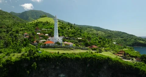 Aerial view of lighthouses perched on cliffs and islands in the ocean Stock Footage 275533879