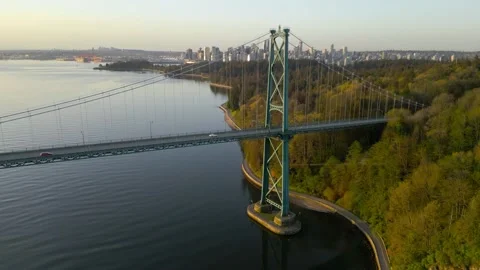 Aerial view of Lions Gate Bridge and Stanley Park at dawn. Canada Stock Footage 252241983