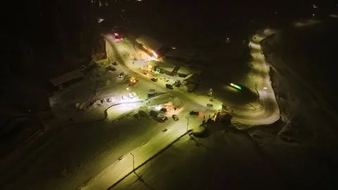 Aerial view of lit pathways and snow reflections at night in Gulmarg Stock Footage 311947529