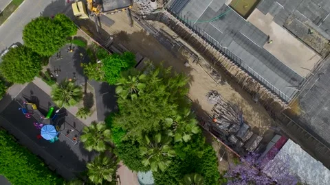 Aerial View: A lively construction site with foundation insulation in progress Stock Footage 296096094