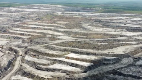 Aerial view of the loading and unloading process of trucks transporting soi.. Stock Footage 328710884