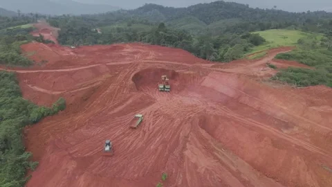 Aerial view of loading and unloading process for road construction Stock Footage 334272945