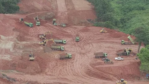 Aerial view of loading and unloading activities of trucks and excavators fo.. Stock Footage 334922134
