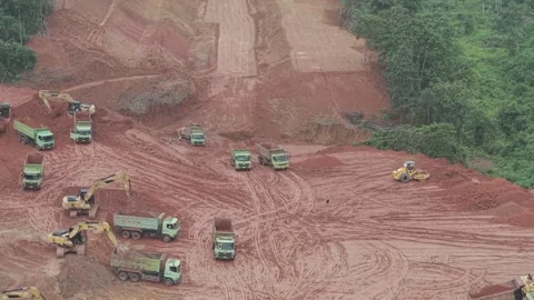 Aerial view of loading and unloading activities of trucks and excavators fo.. Stock Footage 334922203