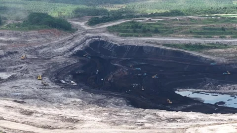 Aerial view of loading and unloading activities at a coal mine Stock Footage 337810169