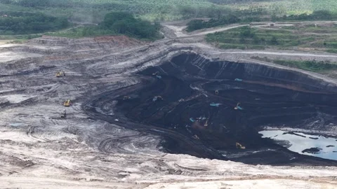 Aerial view of loading and unloading activities at a coal mine Stock Footage 337810170
