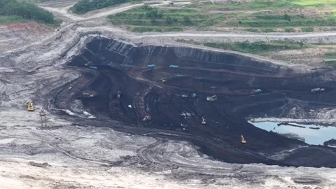 Aerial view of loading and unloading activities at a coal mine Stock Footage 337810407