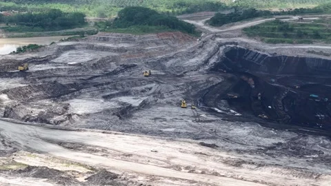 Aerial view of loading and unloading activities at a coal mine Stock Footage 338312663