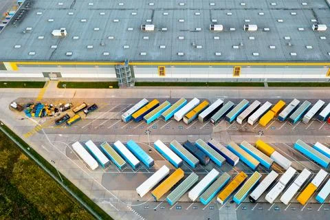 Aerial view of loading trucks in the logistics center of a large transport .. Stock Photos