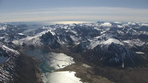 Aerial view of Lofoten with dramatic mountains,peaks &amp; open sea. Stock Footage 87728699