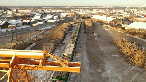 Aerial view of logging train at sawmill hauls stacked wooden logs and tree 스톡 동영상 127107002