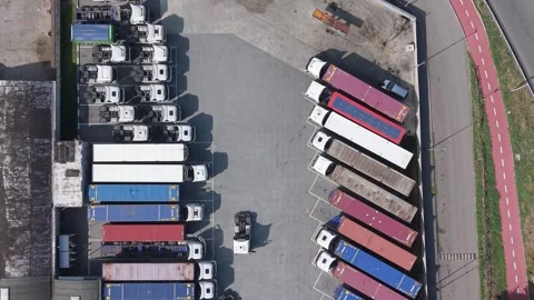 Aerial view of logistics facility with freight trucks, Italy. Stock Footage 345062353