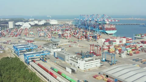 Aerial view of a logistics port with a container ship. Video stock 217424104