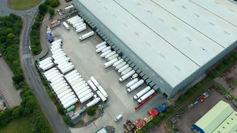 Aerial view of a logistics warehouse facility in United Kingdom. Stock Footage 337636798