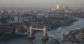 Aerial View of London City Skyline Office Towers and Tower Bridge Sunset Light 4k or 4k+ Resolution