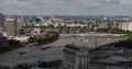 Aerial View of London City Skyline Ferris Wheel and Ferry Boats on Thames River 4k or 4k+ Resolution