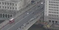 Aerial View of London with People Walk on London Bridge Commuters Commuting Day 4k or 4k+ Resolution