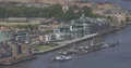 Aerial View of London Skyline with Cargo Ships on Thames River Water Transport 4k or 4k+ Resolution