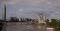 Aerial View of London Skyline Cars Traffic and Ferry Boats Passing Thames River 4k or 4k+ Resolution