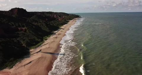 Aerial View of Long Beach Lined by Coastal Cliffs, Conde, Paraíba Stock Footage 320571050