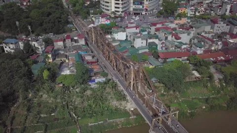 Aerial view of long bien bridge crossing the red river in hanoi Stock Footage 329501647