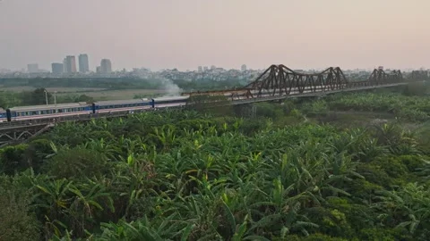 Aerial View of Long Bien Bridge and Banana Gardens in Hanoi, Vietnam Stock Footage 344741567