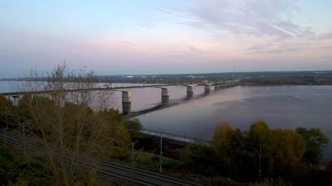 Aerial view of a long bridge over a wide river, active traffic on the bridge.the Stock Footage 118635004