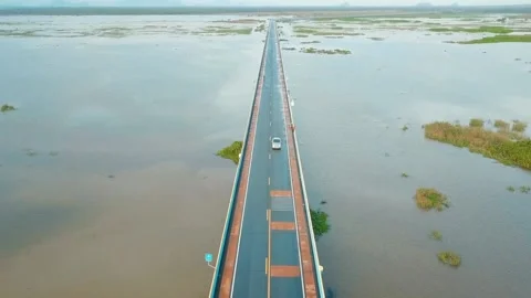 Aerial View of Long Bridge Spanning Wide Waterway Video stock 310992227