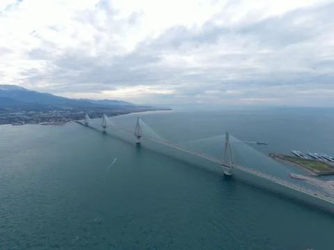 Aerial view of long cable-stayed Rio bridge in Greece at clouds weather, Ferry Stock Photos