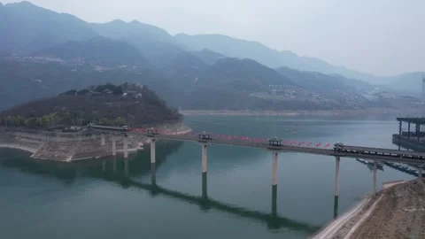 Aerial view of a long covered bridge over the Yangtze River in Chongqing Stock Footage 342305639