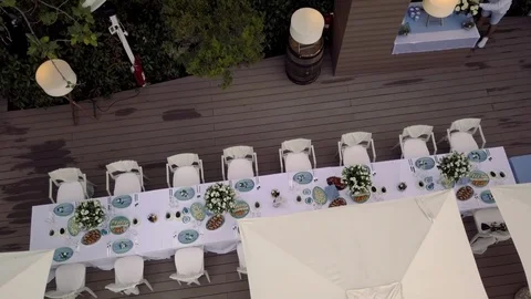 Aerial view of Long festive table with snacks and flowers in nature Stock Footage 123799959