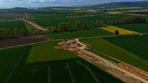 Aerial View of Long Infrastructure Construction Trench Through Agricultural Photos