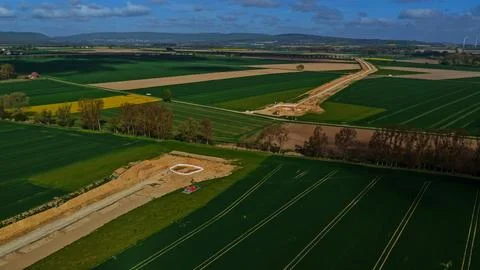 Aerial View of Long Infrastructure Construction Trench Through Agricultural Stock-Fotos
