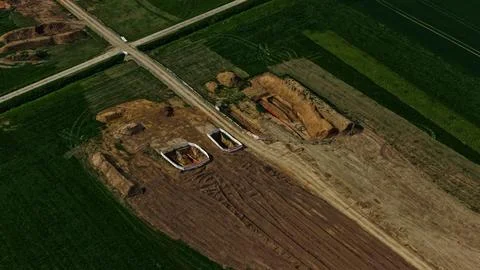 Aerial View of Long Infrastructure Construction Trench Through Agricultural Photos