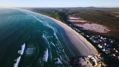 Aerial view of long sandy beach and Atlantic Ocean waves South Africa Stock Footage 330879647