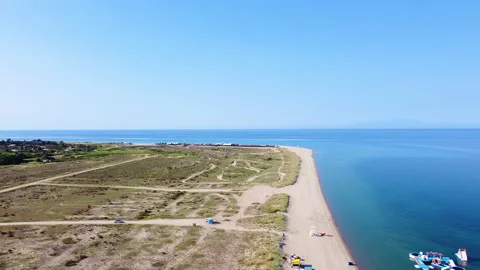 Aerial view of long spacious beach with white sand and amazing blue sea Video stock 135734751