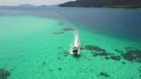 Aerial view of long-tailed boat is sail on the emerald sea. Andaman sea Stock Footage 169068341